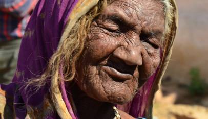 Elderly Indian woman in a sari, representing senior pensioners