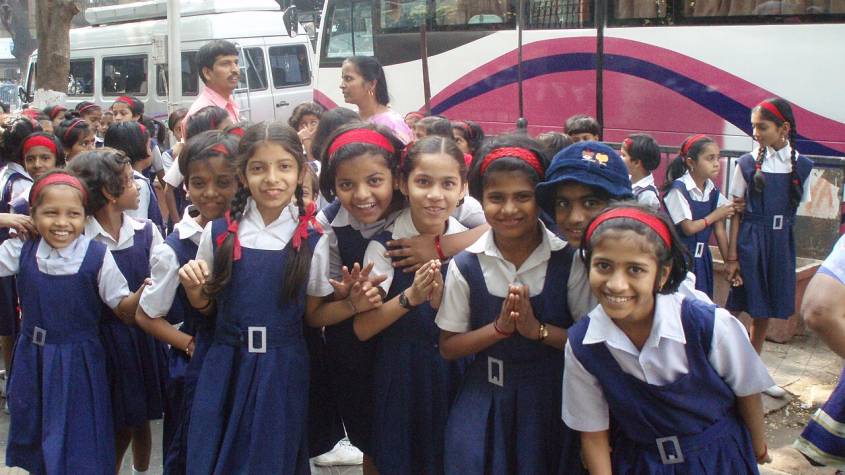 School girls in uniform walking together in Mumbai, representing students applying for NSP scholarships